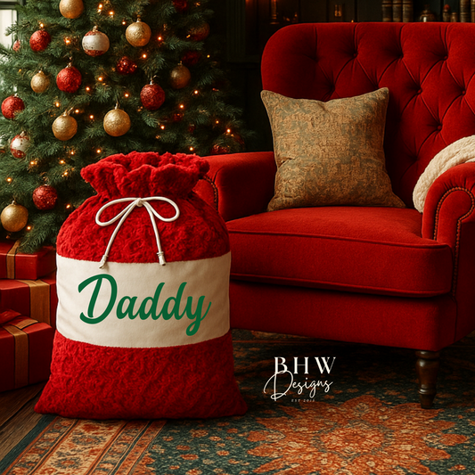 Red Santa sack with 'Daddy' on it in green