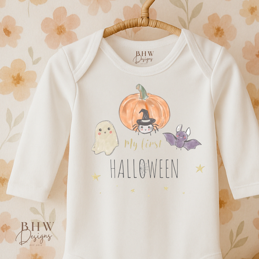Baby onesie with My first Halloween design on a floral background