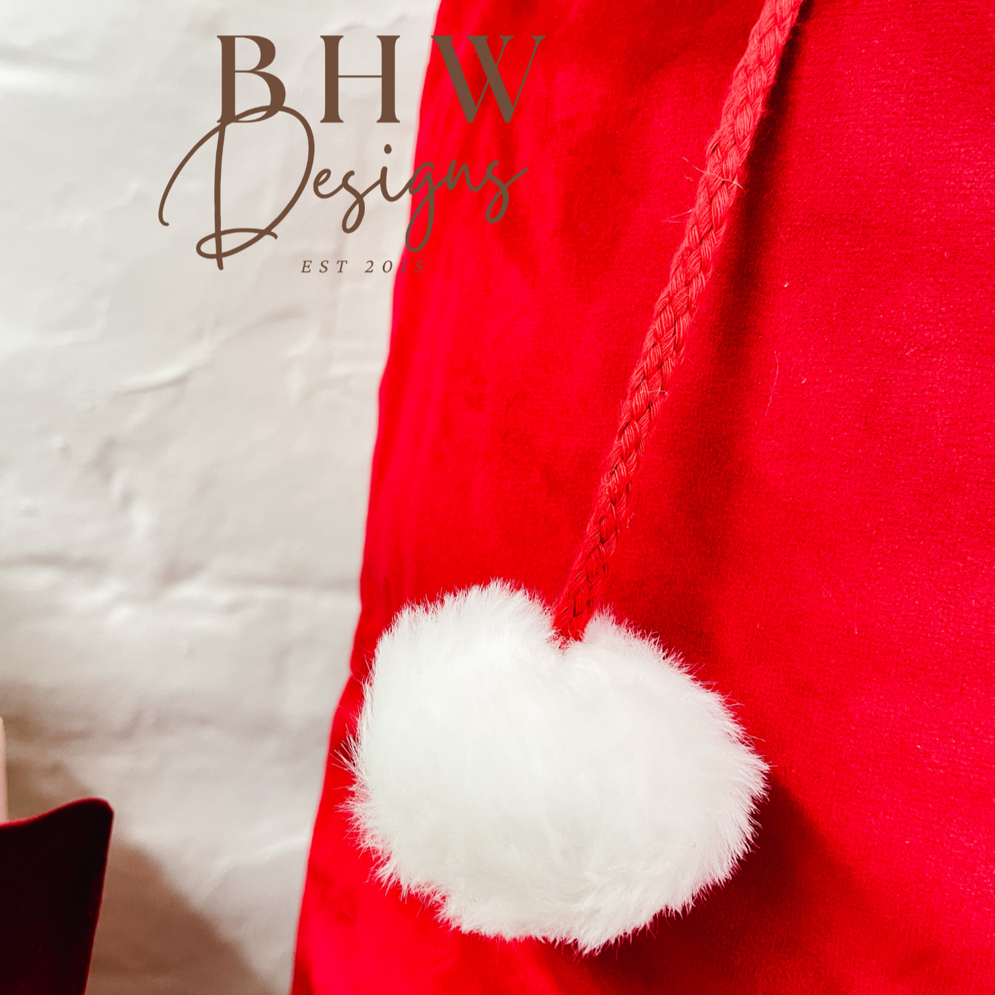 Red Santa hat with white pom-pom
