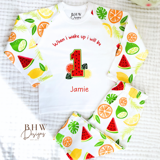 Fruit-themed pyjamas with 'BHW Designs' branding on a textured surface.