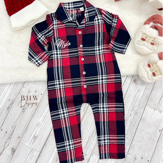 A tartan patterned romper onesie for babies, personalised on the front with a name in script font