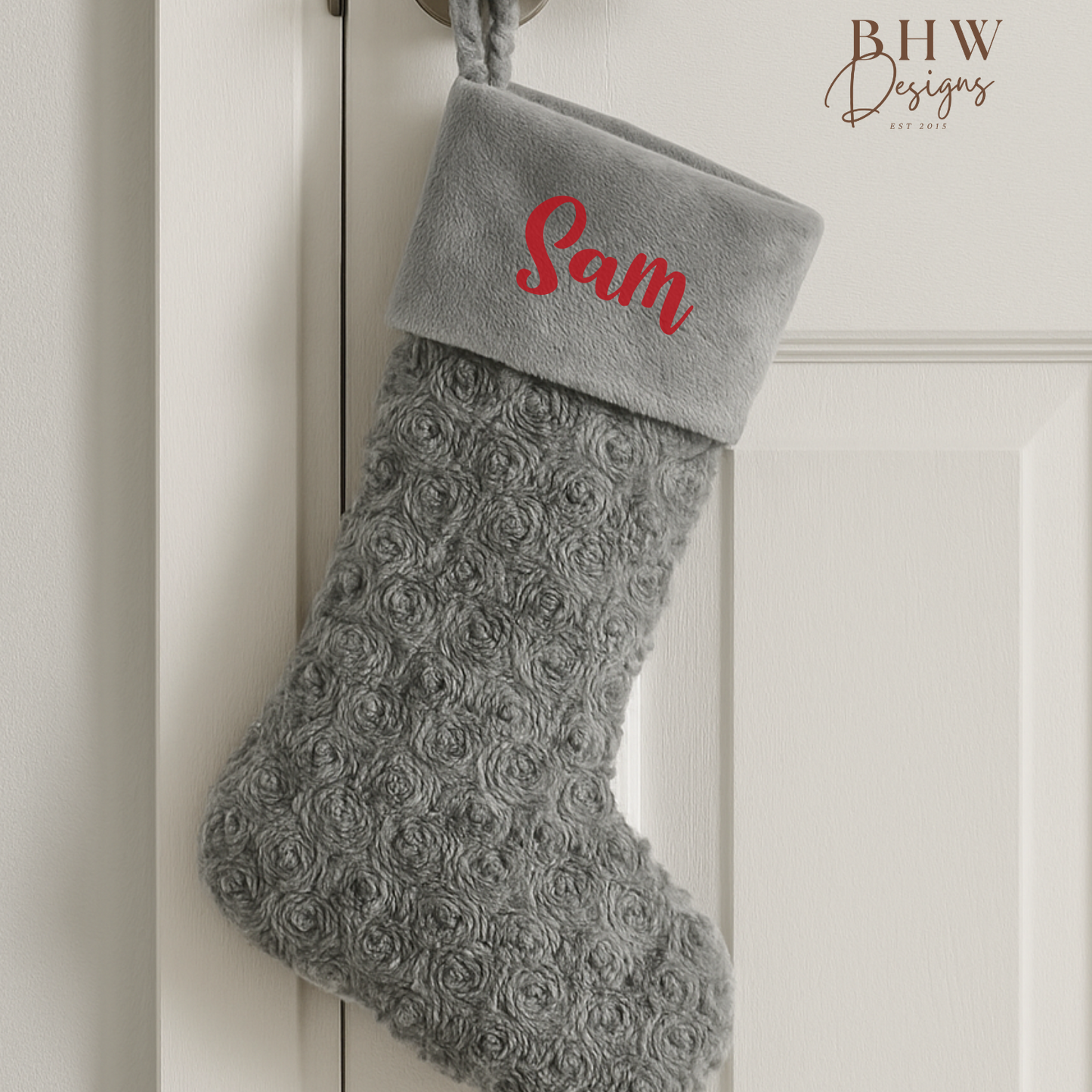 Grey textured Christmas stocking with 'Sam' on a white door, featuring BHW Designs branding.