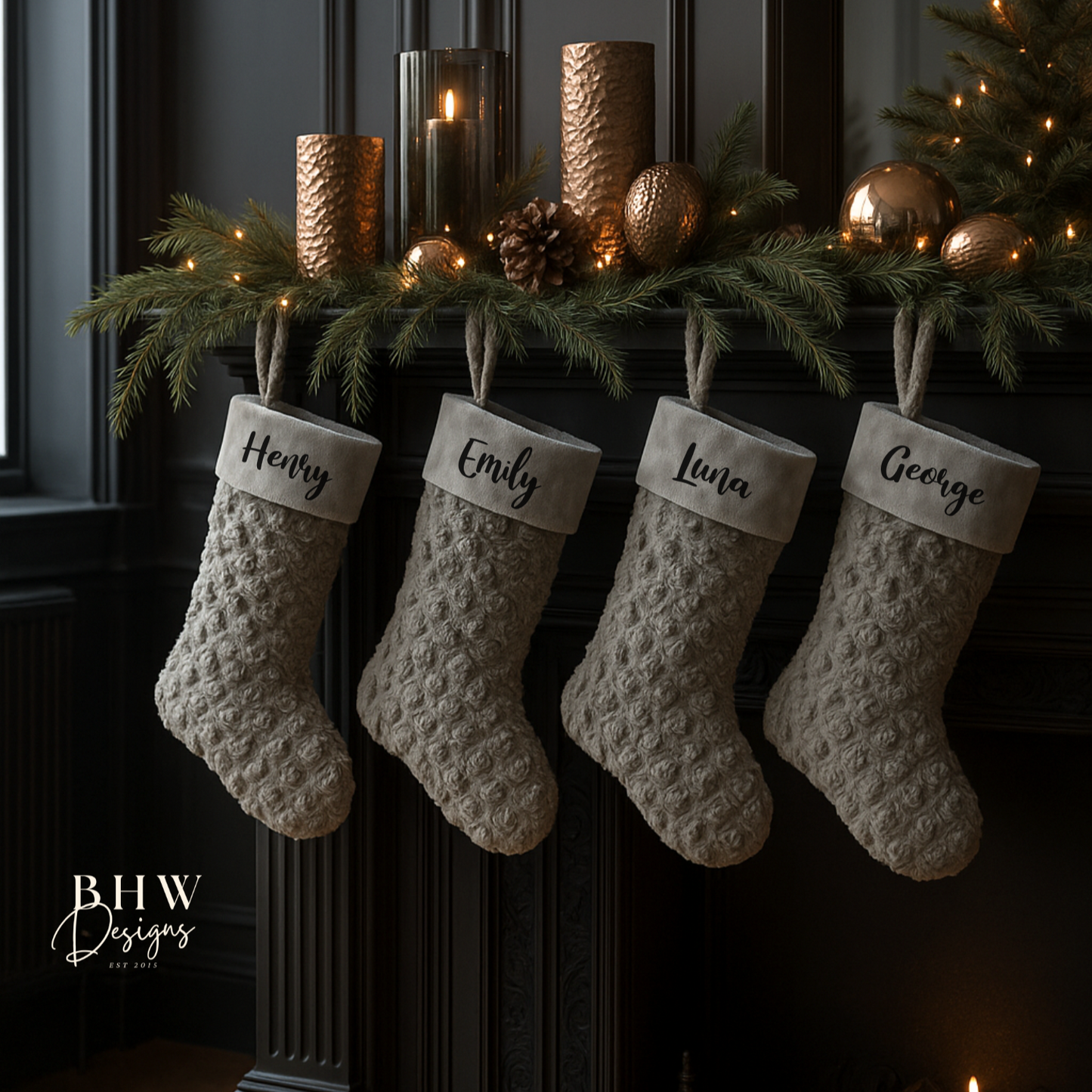 Four textured stockings hanging on a fireplace mantle with decorative items.