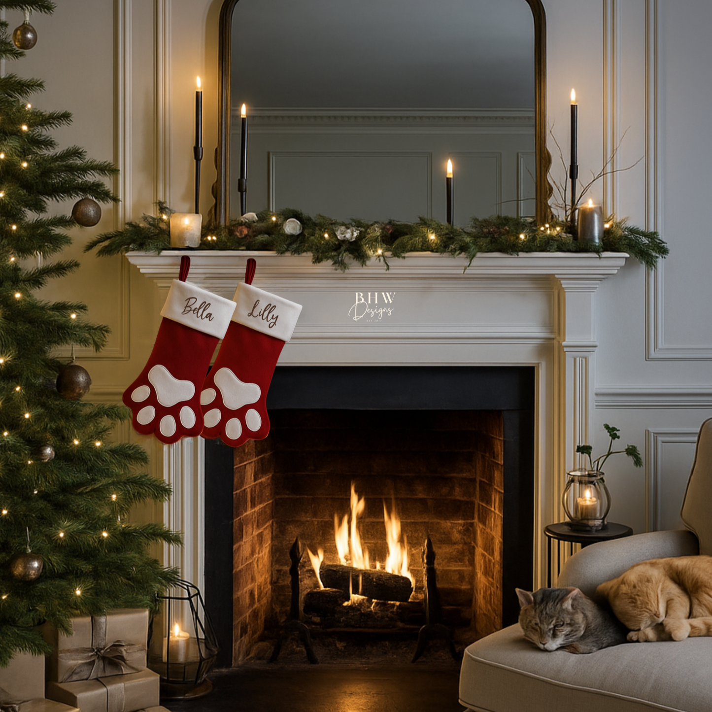 Cozy living room with Christmas tree, two personalised red and white stockings in a paw shape with Bella and Lilly in brown hanging on a fireplace.