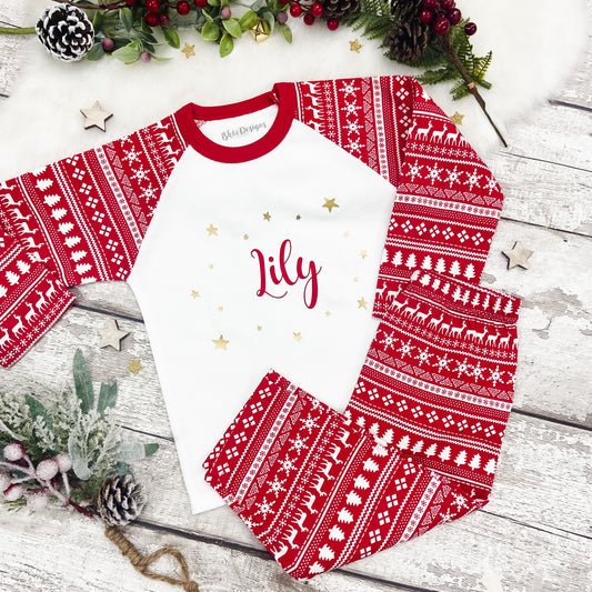 Red and white fair isle patterned pyjamas set with 'Lily' in red surrounded by gold stars