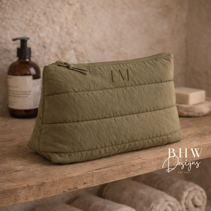 Olive green toiletry bag with 'EM on the front 