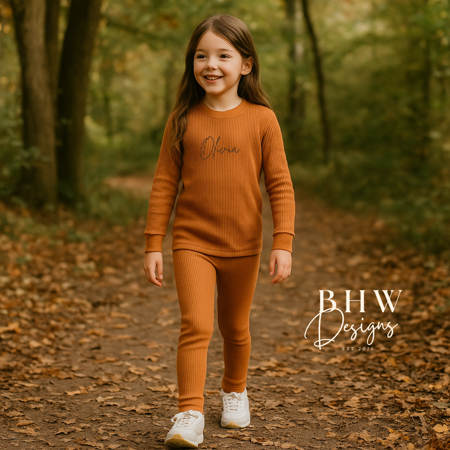 Young girl in a rust outfit standing in a forest 