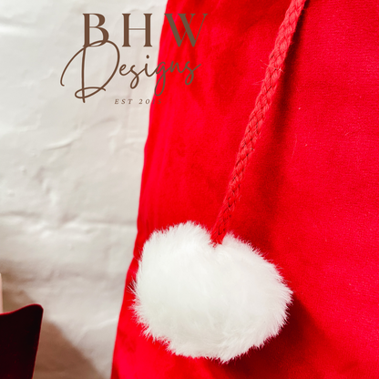 Red Santa hat with white pom-pom 