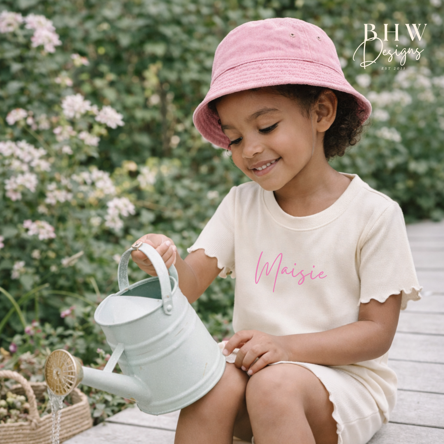 Child in a pink bucket hat