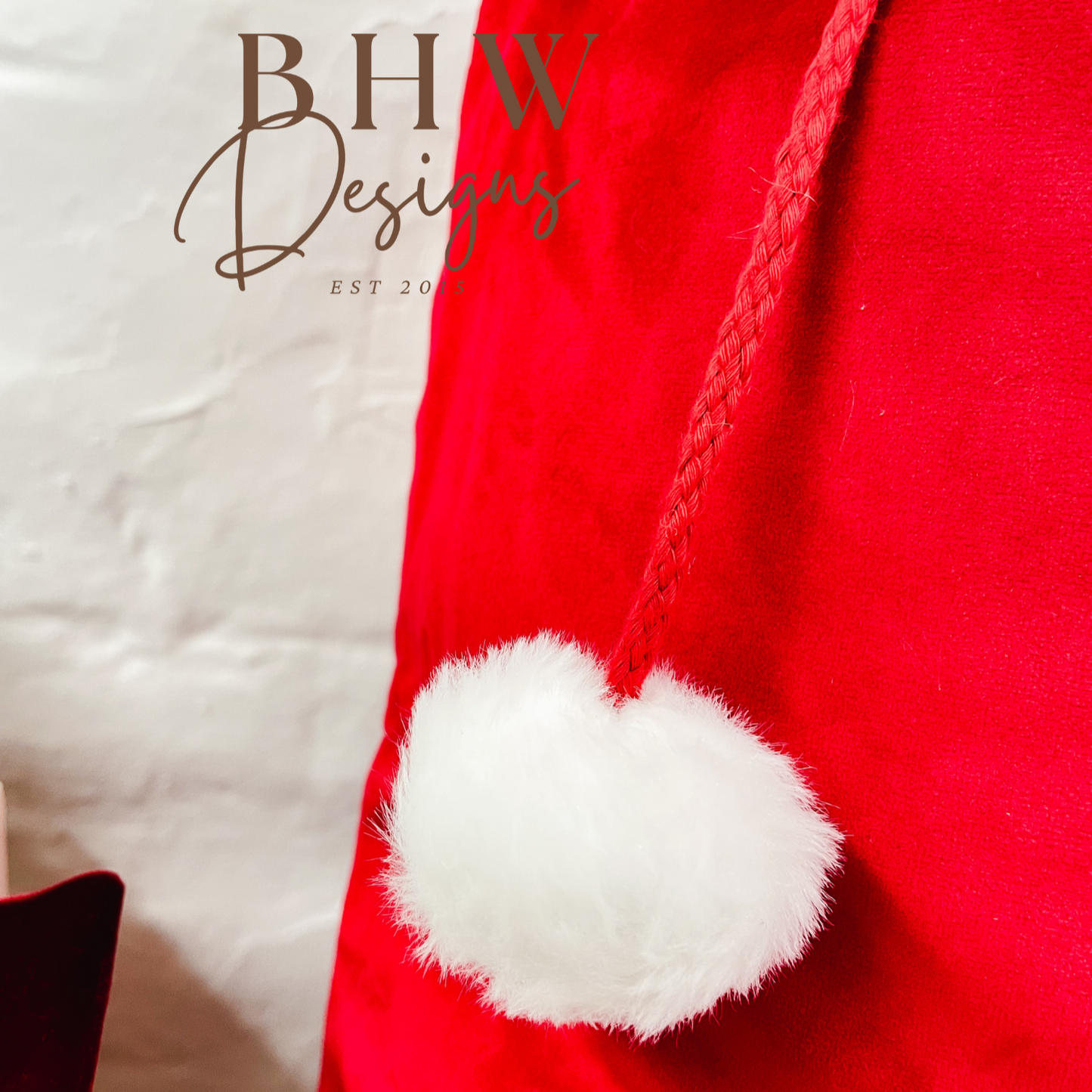 Red Santa hat with white pom-pom 