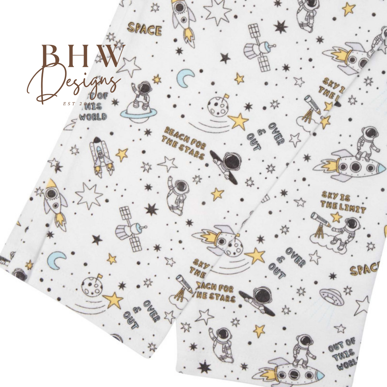 Fabric with space-themed designs and text on a white background, featuring logos and text.