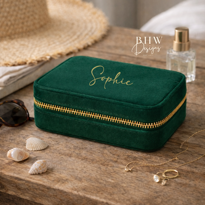 Green velvet  jewellery box with gold zipper on a wooden surface,