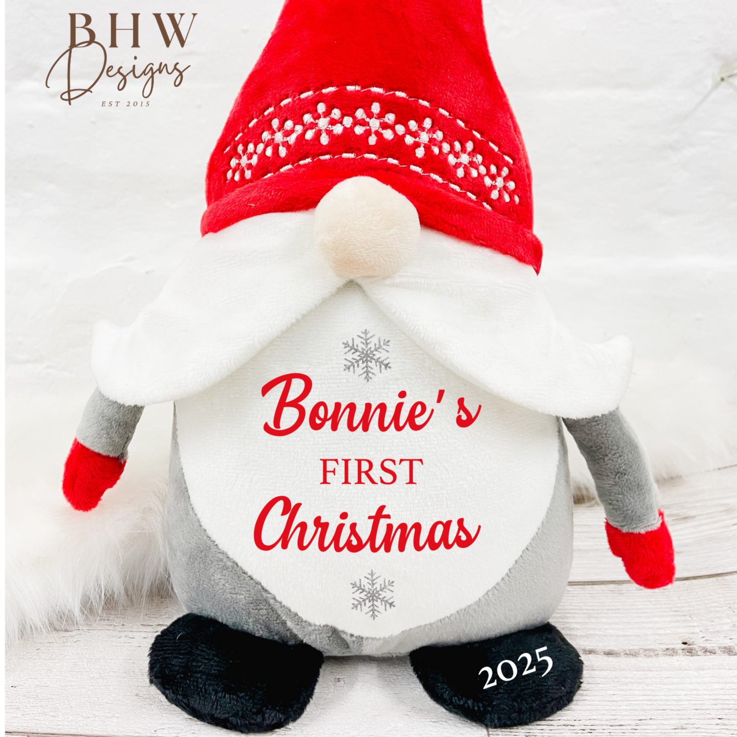 Christmas-themed gnome plush toy with 'Bonnie's First Christmas 2025' text on a white background.