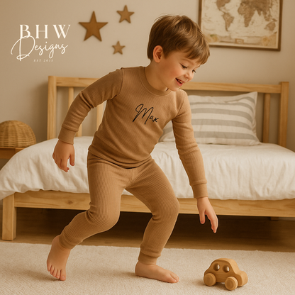 boy in a stone outfit playing with a wooden toy car in a bedroom setting