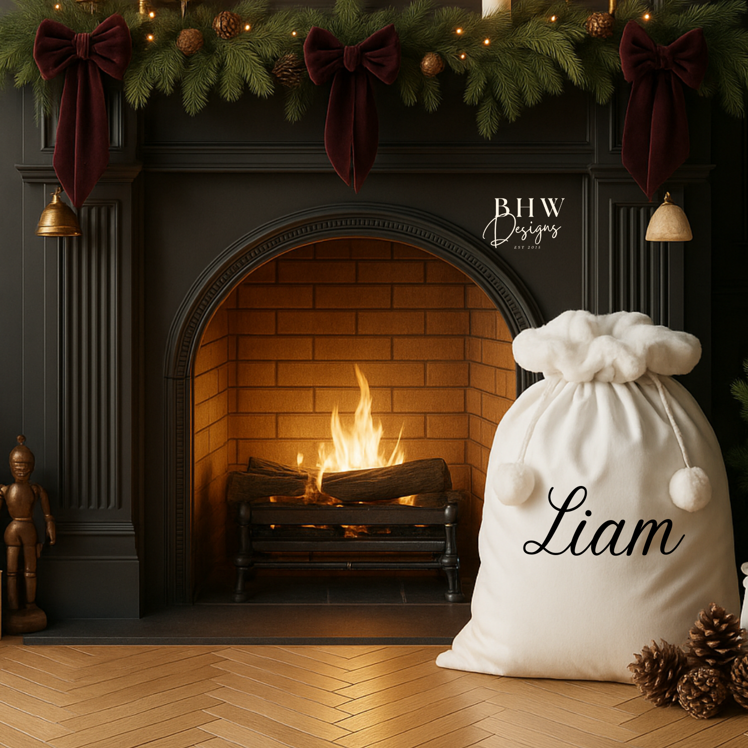 Decorative room with a a white Santa sack with white faux fur trim and pom pom's with Liam on the front in black