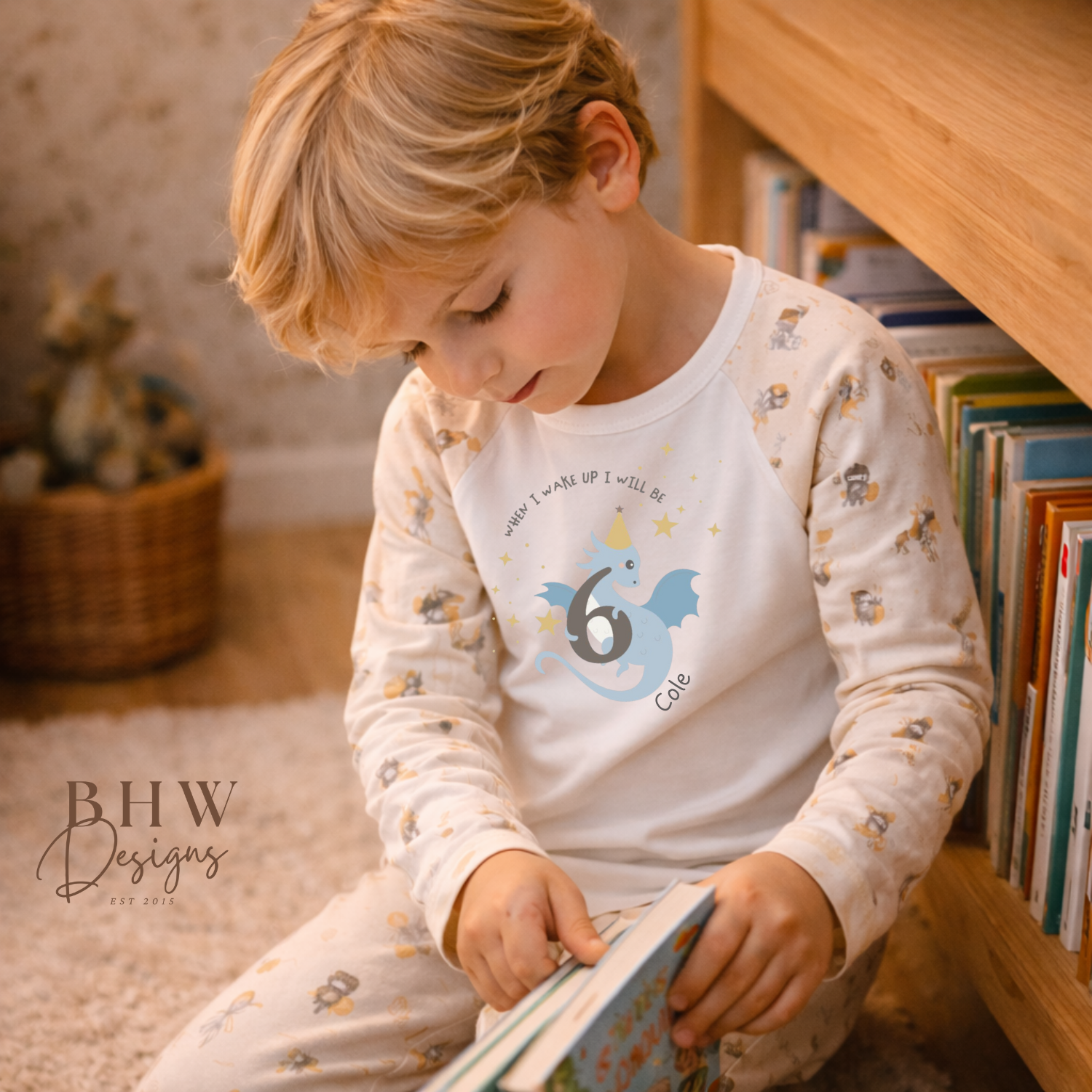 Child reading a book in a cozy room with books and toys.