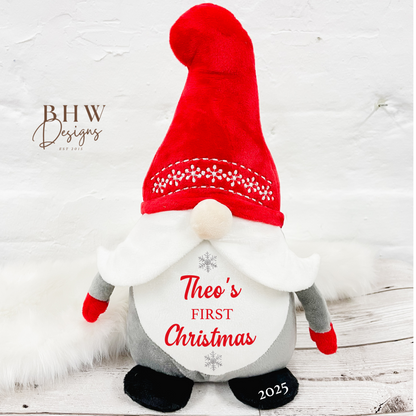 Christmas-themed gnome with red hat and white beard personalised with a name and first christmas in red with silver stars 