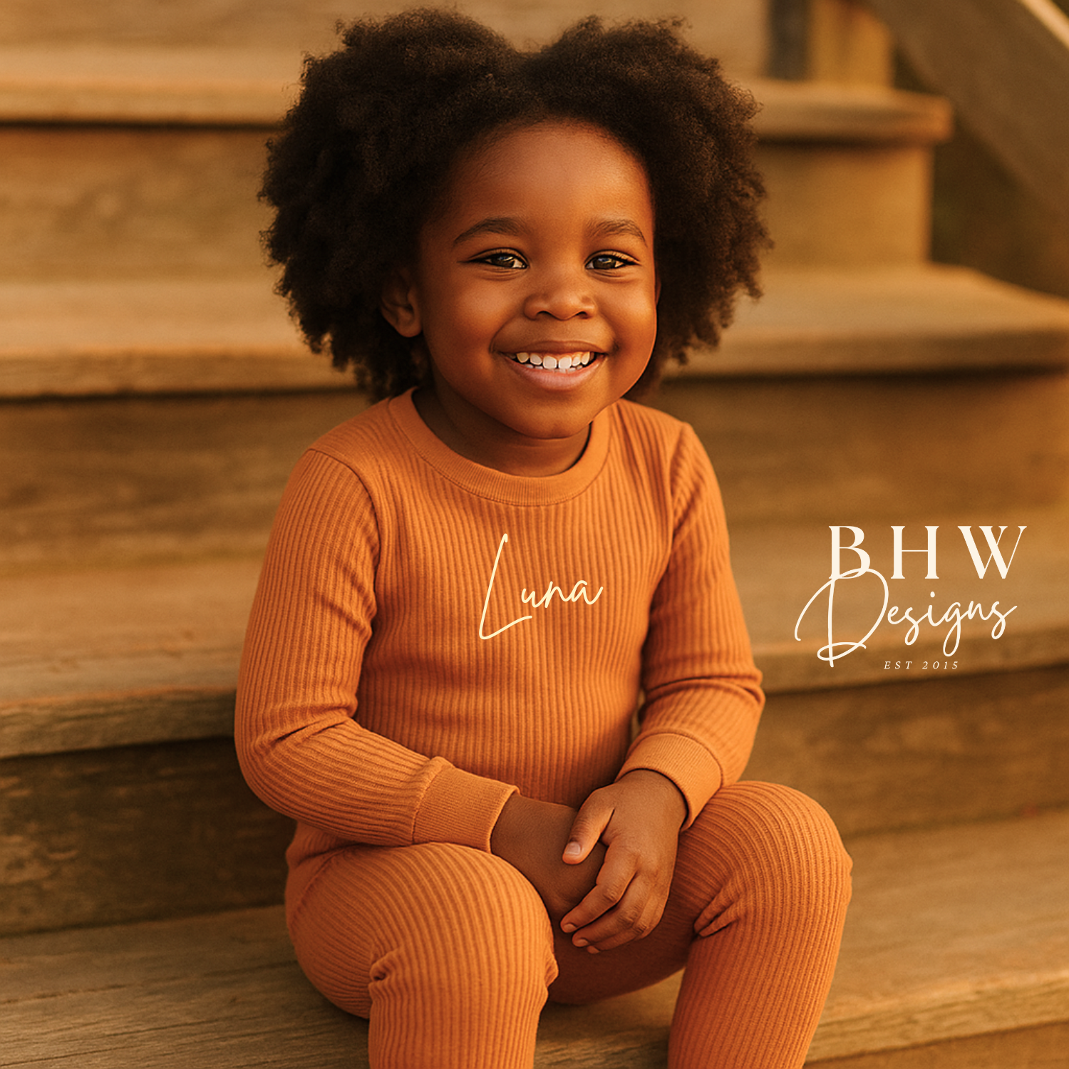 Girl wearing a personalised rust ribbed outfit sitting on wooden steps 