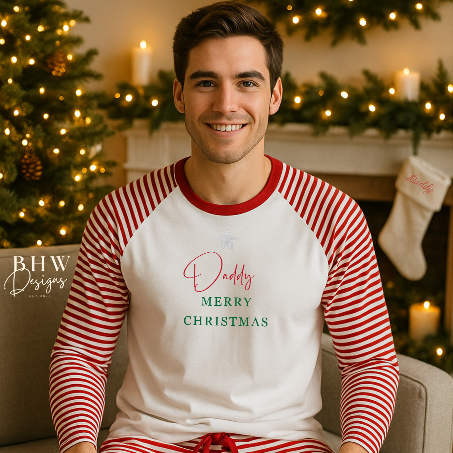 Man wearing a red and white striped Pyjamas with 'Daddy Merry Christmas' text in a festive setting.
