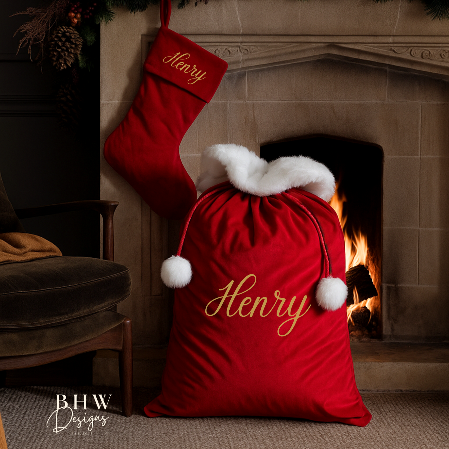 Red Christmas sack and stocking with 'Henry' personalised, in front of a fireplace.