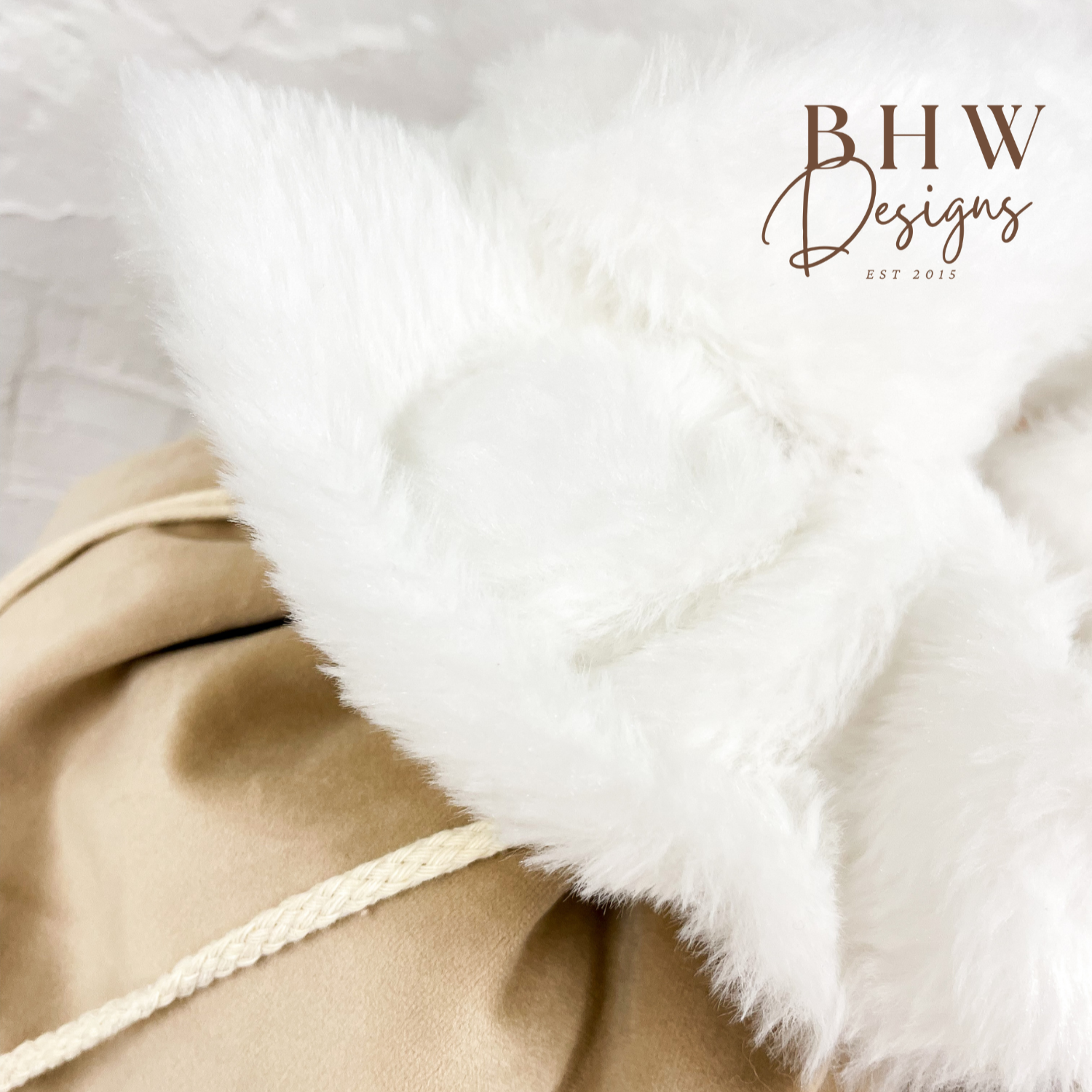 Close-up of a beige Santa sack with white fur trim, 