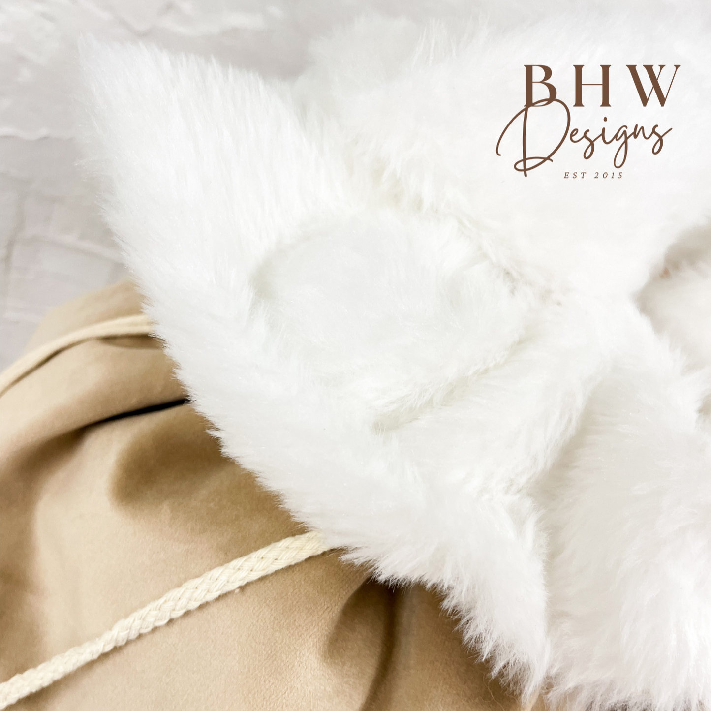 Close-up of a beige santa sack with white fur trim, 