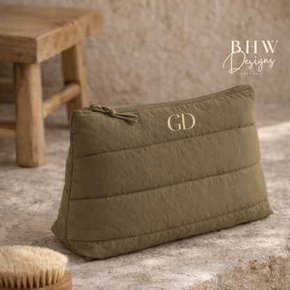 Olive green quilted pouch with initials on a rustic surface, featuring the brand 'BHW Designs'.