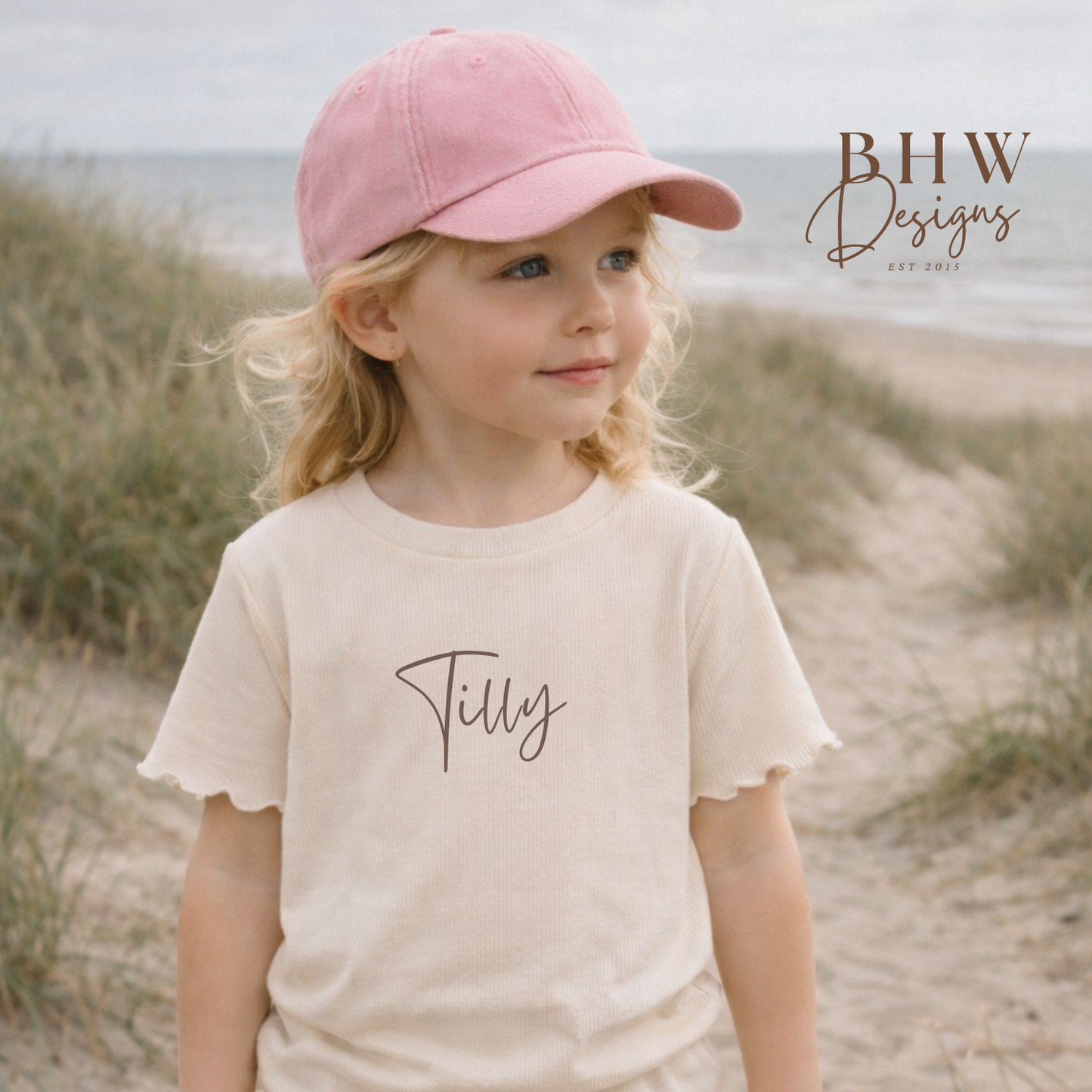 Young girl wearing a pink cap 