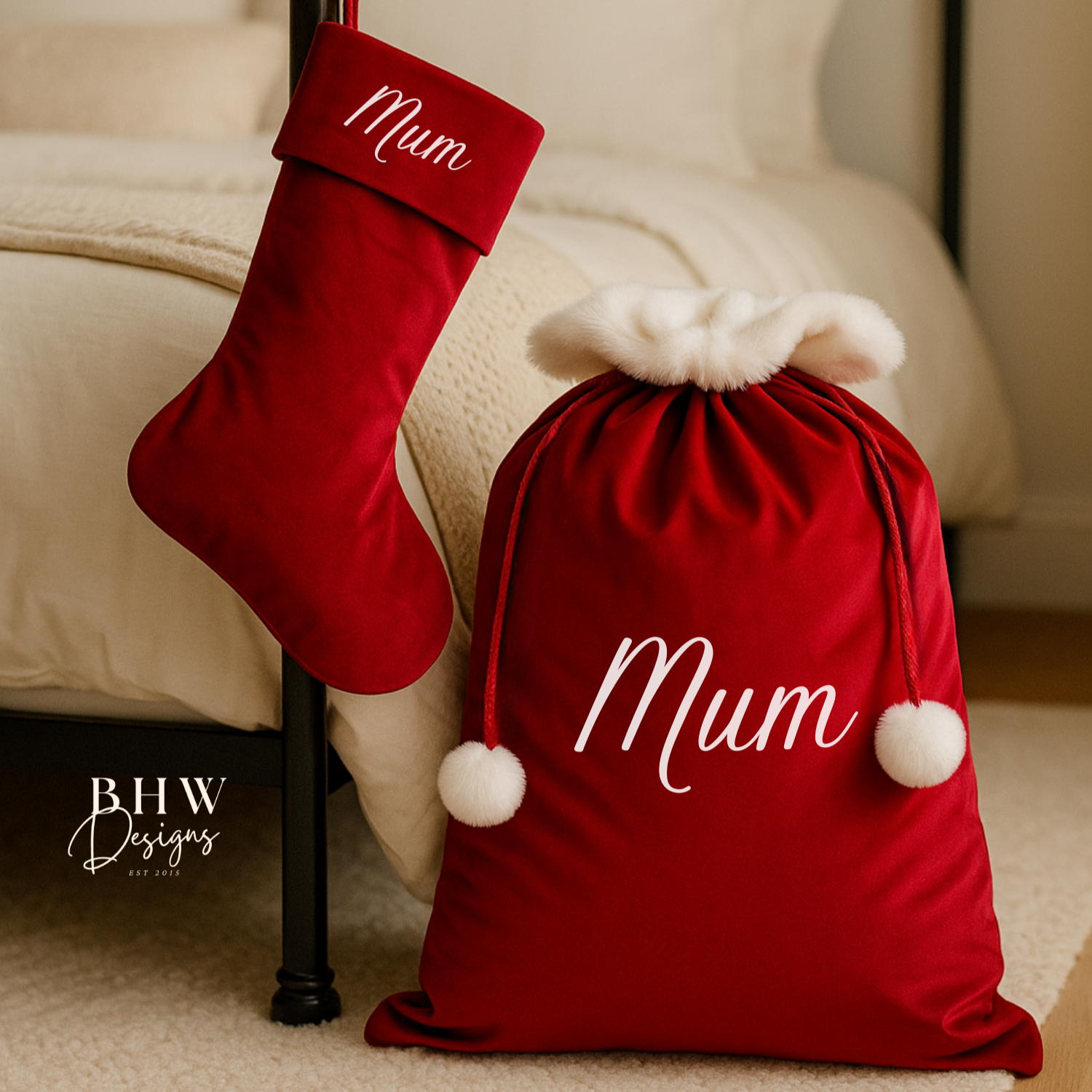 Red Christmas stocking and sack with 'Mum' on a bed in a cozy room.