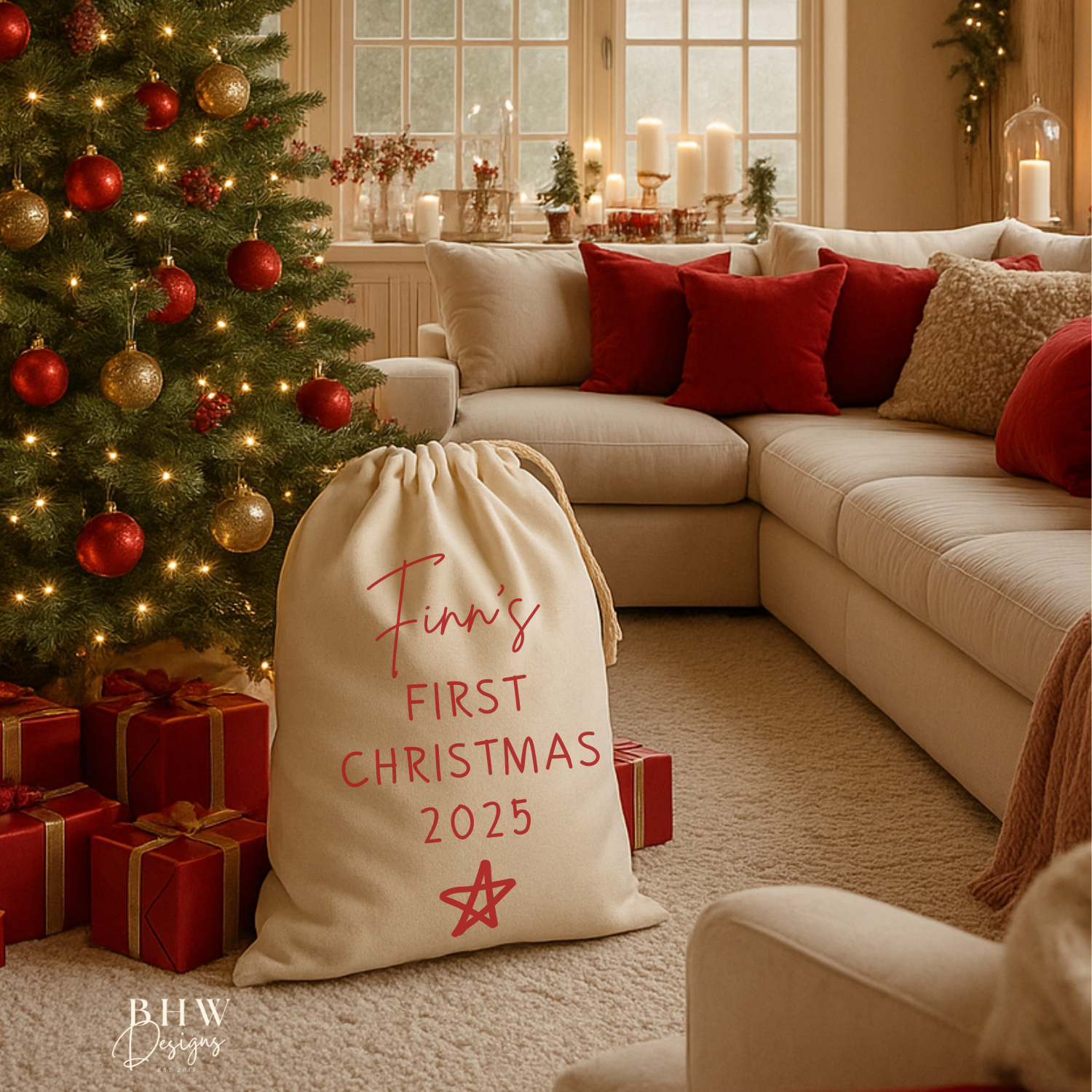 Decorated living room with Christmas tree, presents, and a Cotton santa Sack Personalised with a name and my first Christmas 2025 in red