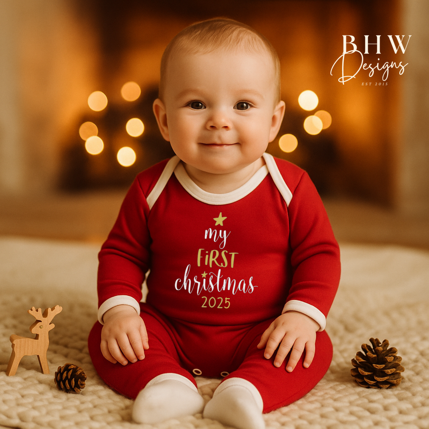 Baby wearing a red 'My First Christmas 2025' outfit 