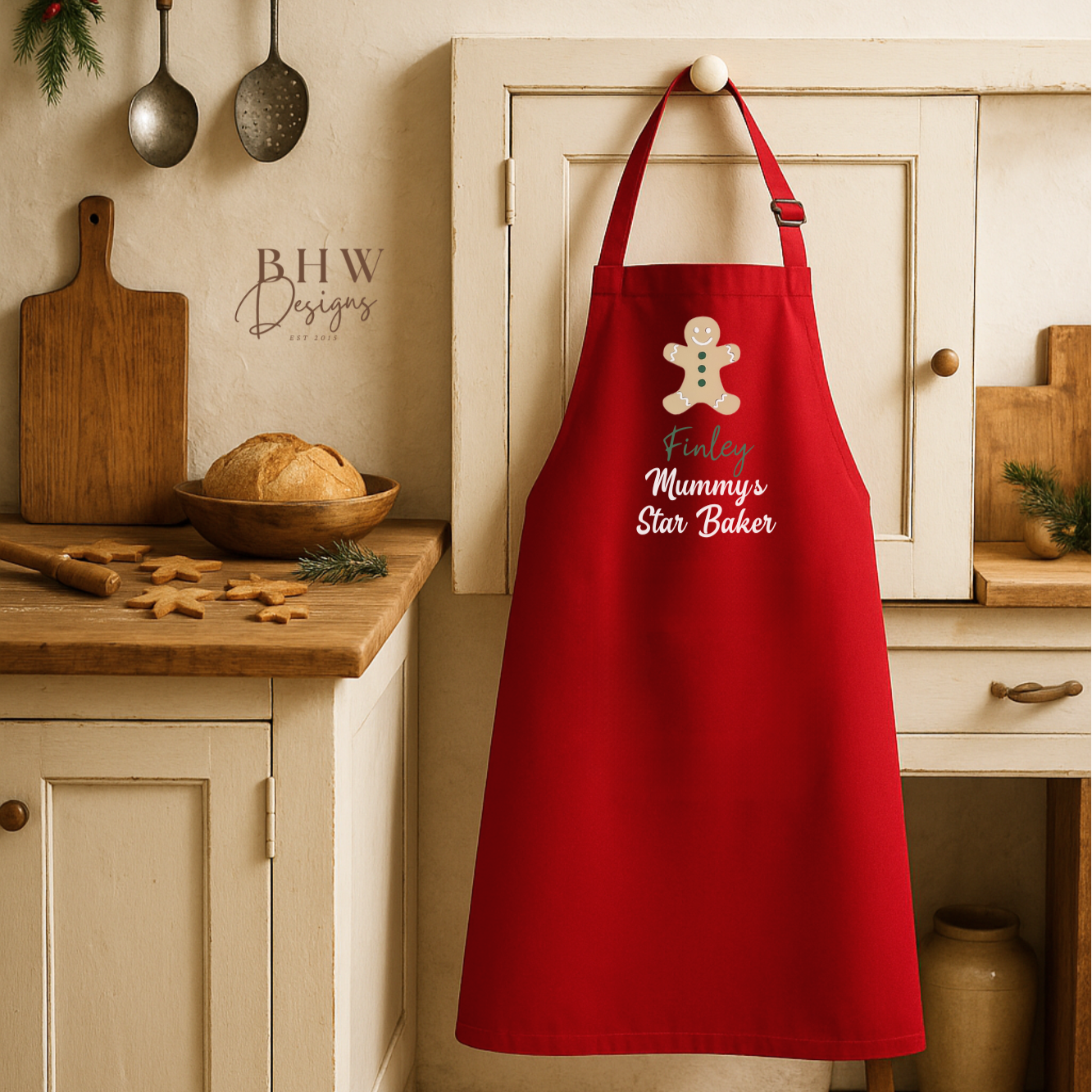 Red apron with 'Mummy's Star Baker' text hanging in a kitchen.