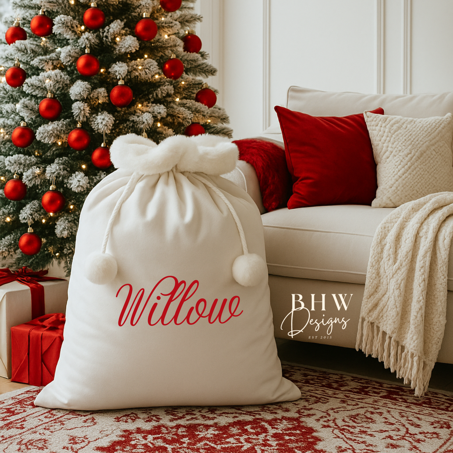 A white Santa sack with white faux fur trim and pom pom's with Willow on the front in Red