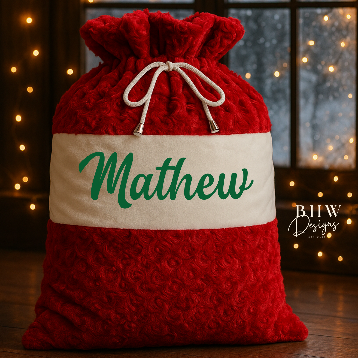 Red and white textured santa sack with 'Mathew' on the front in green