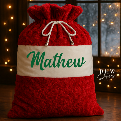 Red and white textured santa sack with 'Mathew' on the front in green