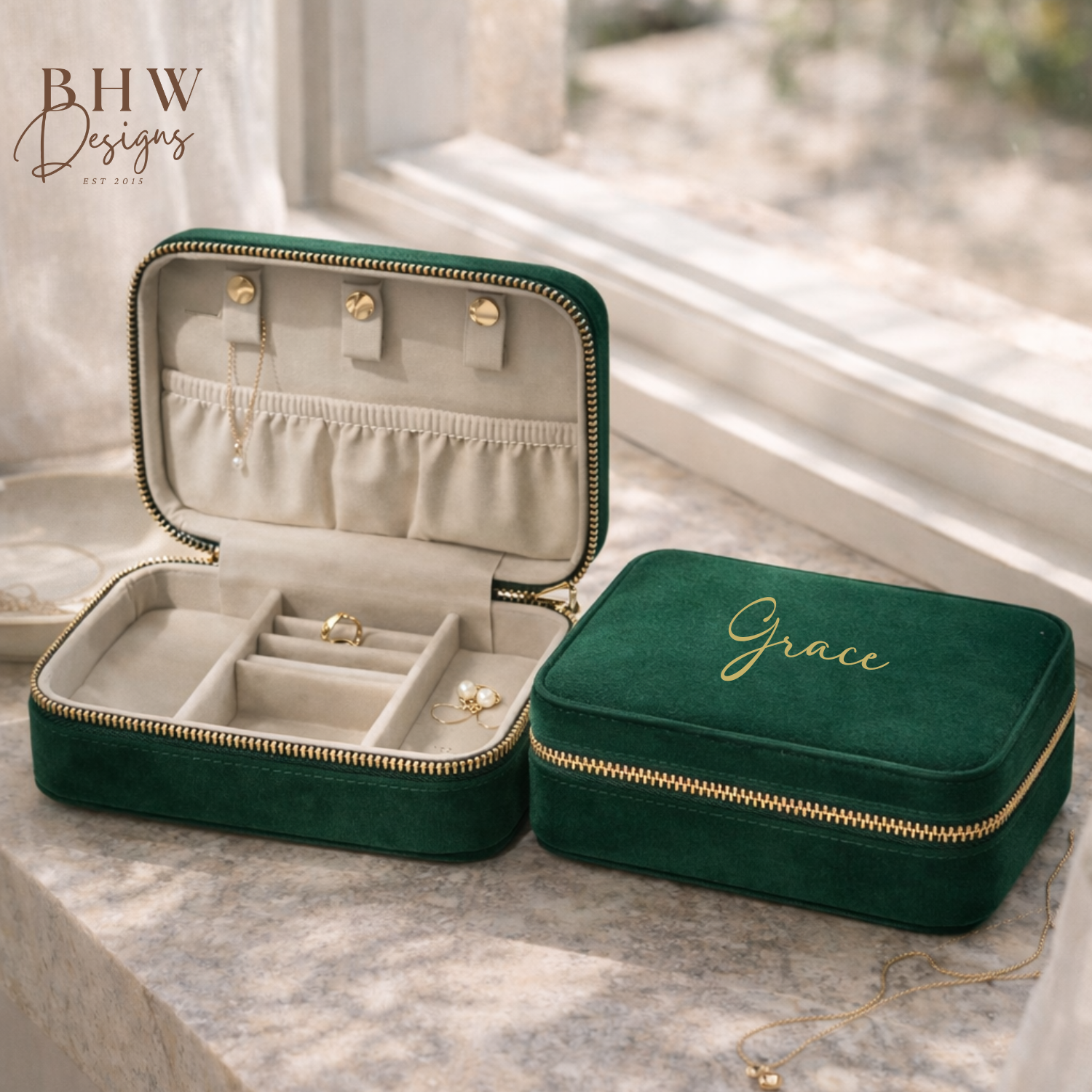 Green velvet jewellery case with 'Grace' on a marble surface, 