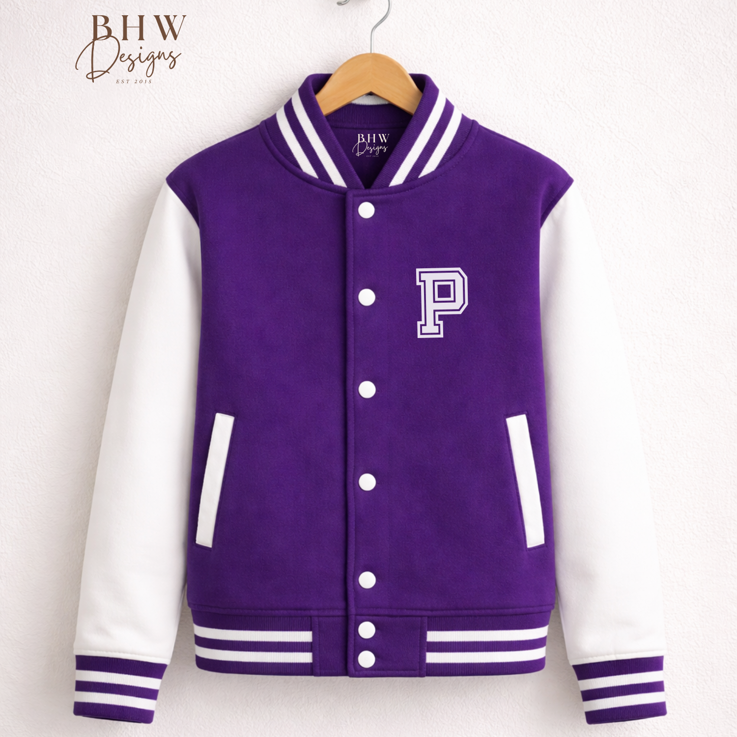 Purple and white varsity jacket with a letter 'P' on a wooden hanger against a white background.