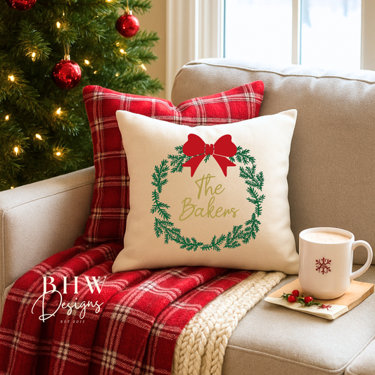 Cozy living room with a Christmas tree, plaid blanket, and decorative personalised wreath and bow design cushion cover