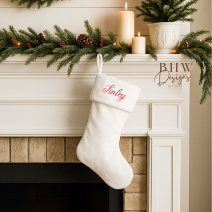 Decorative Christmas white velvet stocking with name personalised in red.