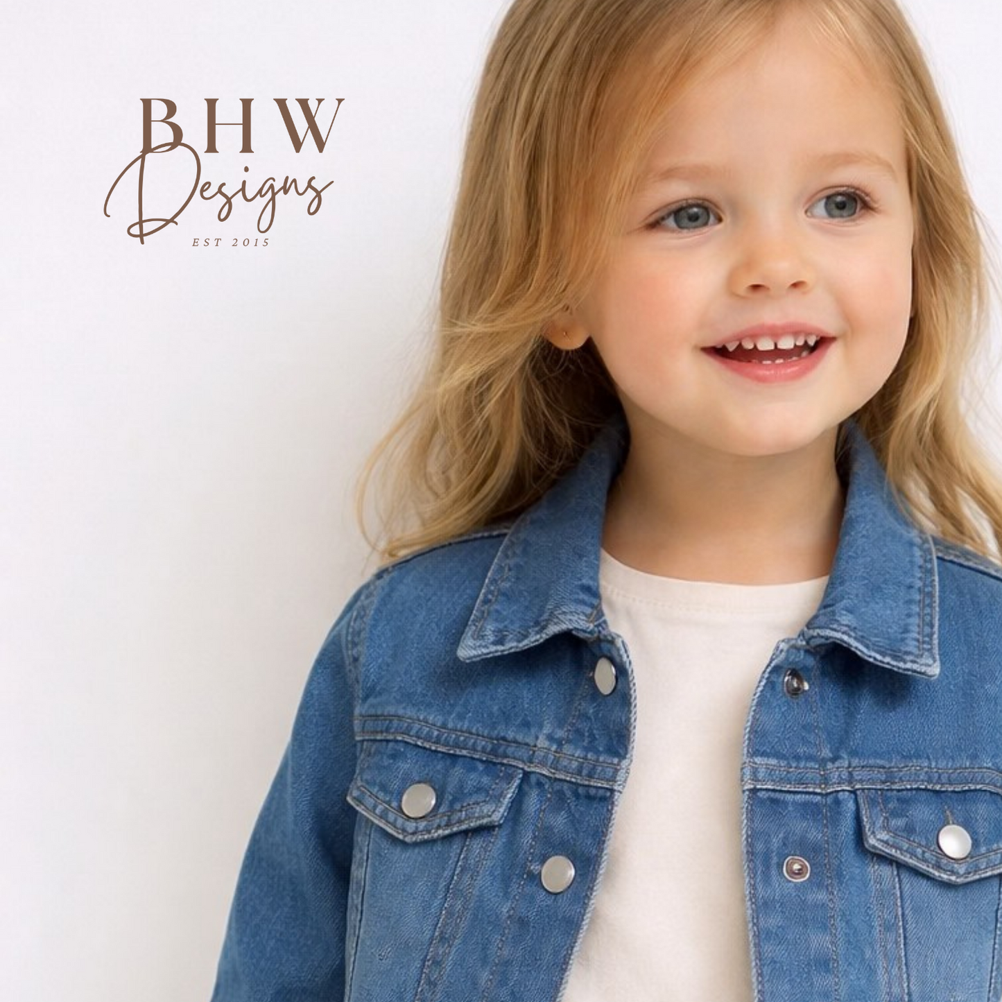 Child wearing a blue denim jacket 