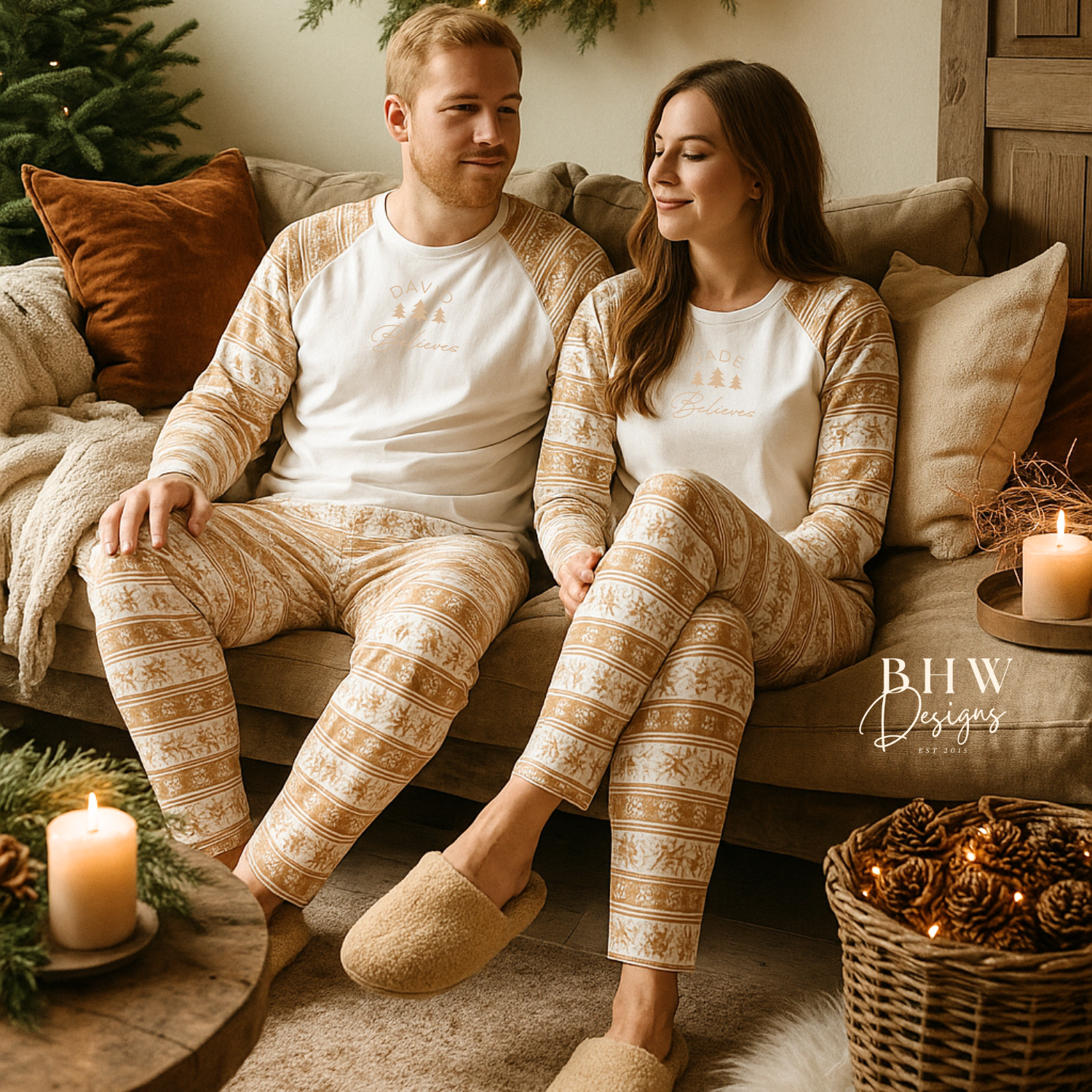 Woman and man wearing a white and beige pyjama set personalised with name and 'Believe' text, on the front in beige. 