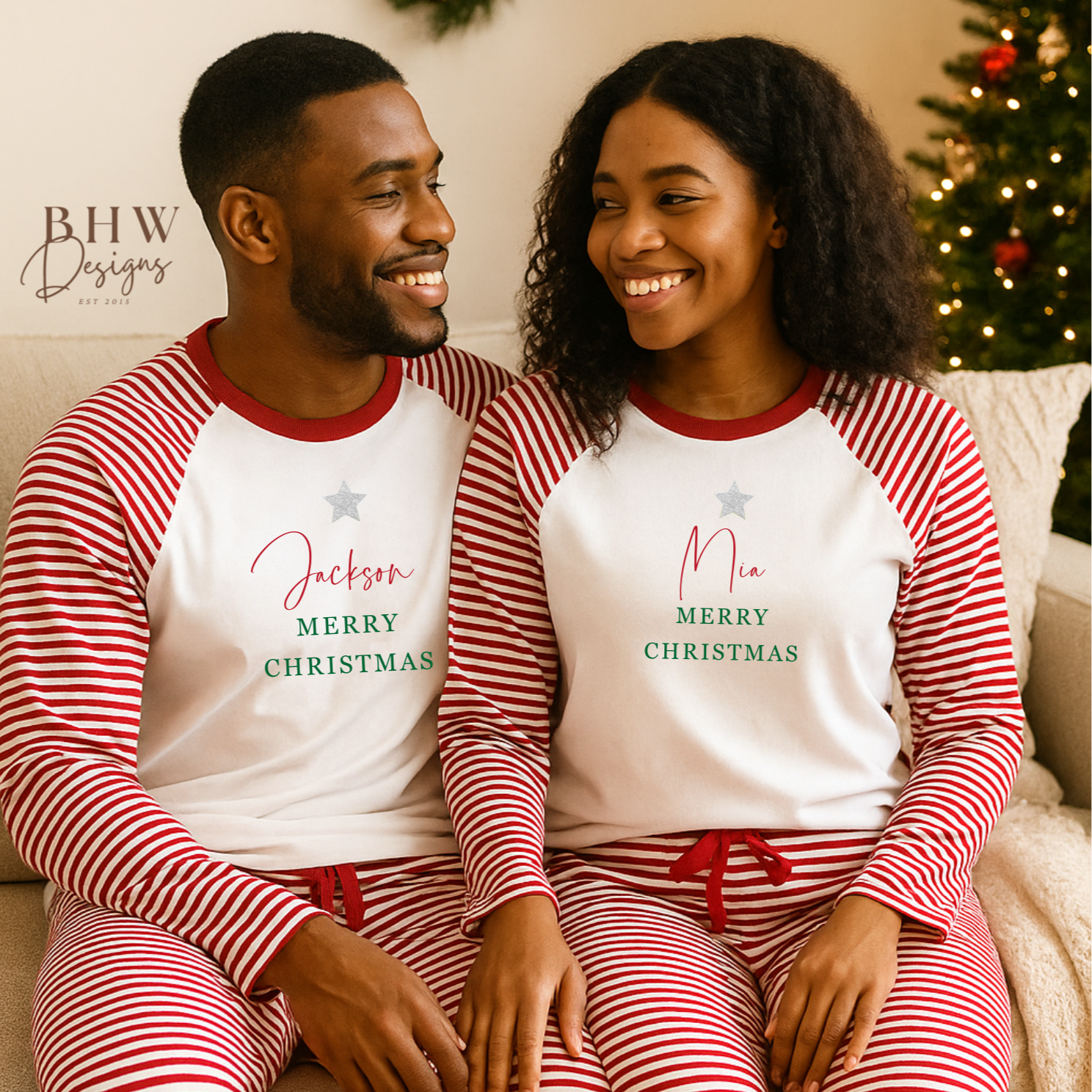Two people wearing red and white striped Christmas pajamas with personalised names.