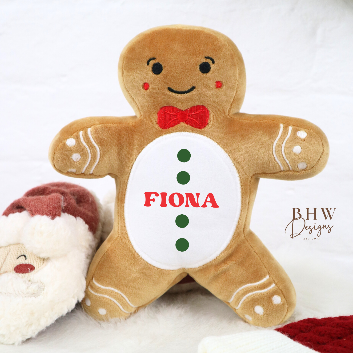 Gingerbread man plush toy with 'Fiona' on a white background, featuring Santa Claus.