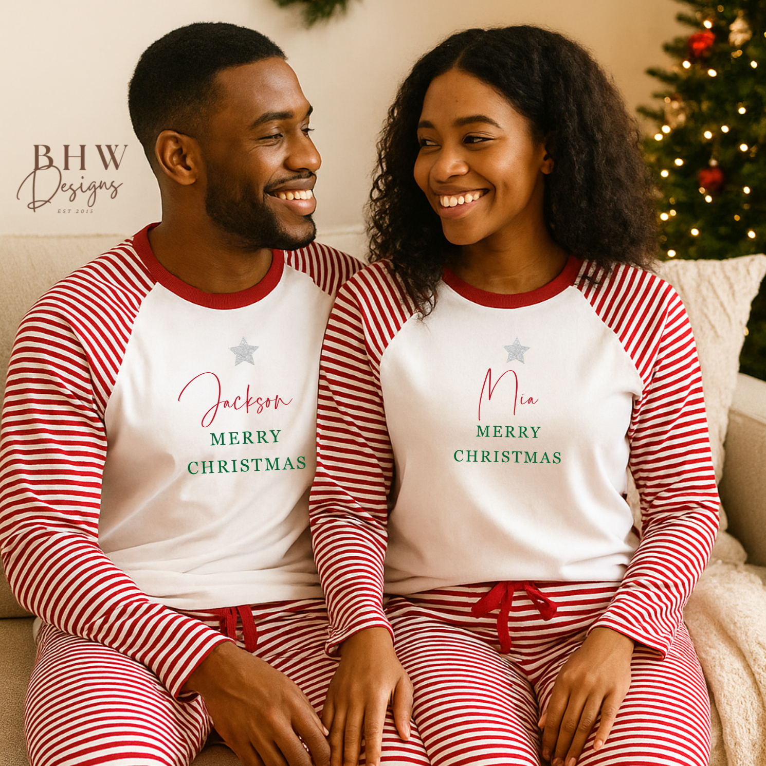 Two people wearing red and white striped Christmas pajamas with personalised names.