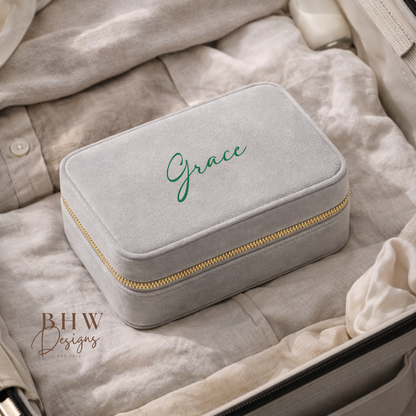 Grey jewellery box with 'Grace' on the top in a suitcase, 