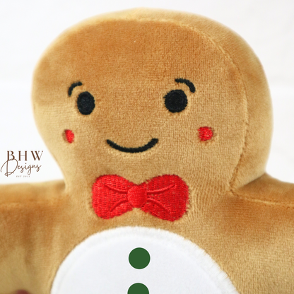 Gingerbread man plush toy with a red bow tie and 'HARRY' on a white background