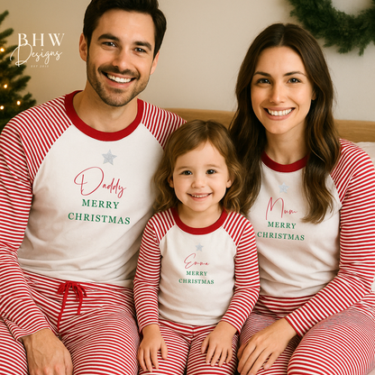 Family of three wearing matching red and white stripe Christmas pyjamas with personalised names.