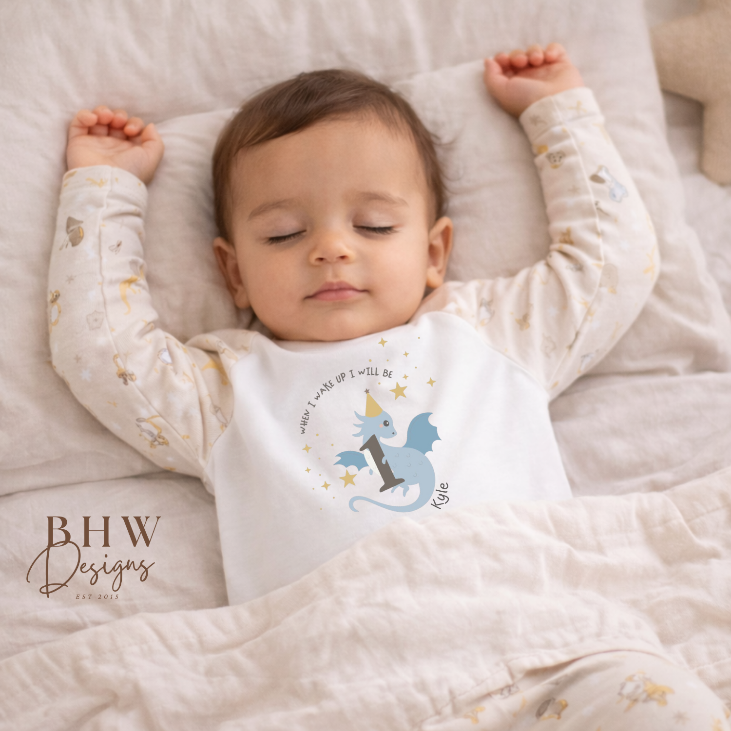 Child wearing dragon and knight print pyjamas with a personalised dragon design on the front.
