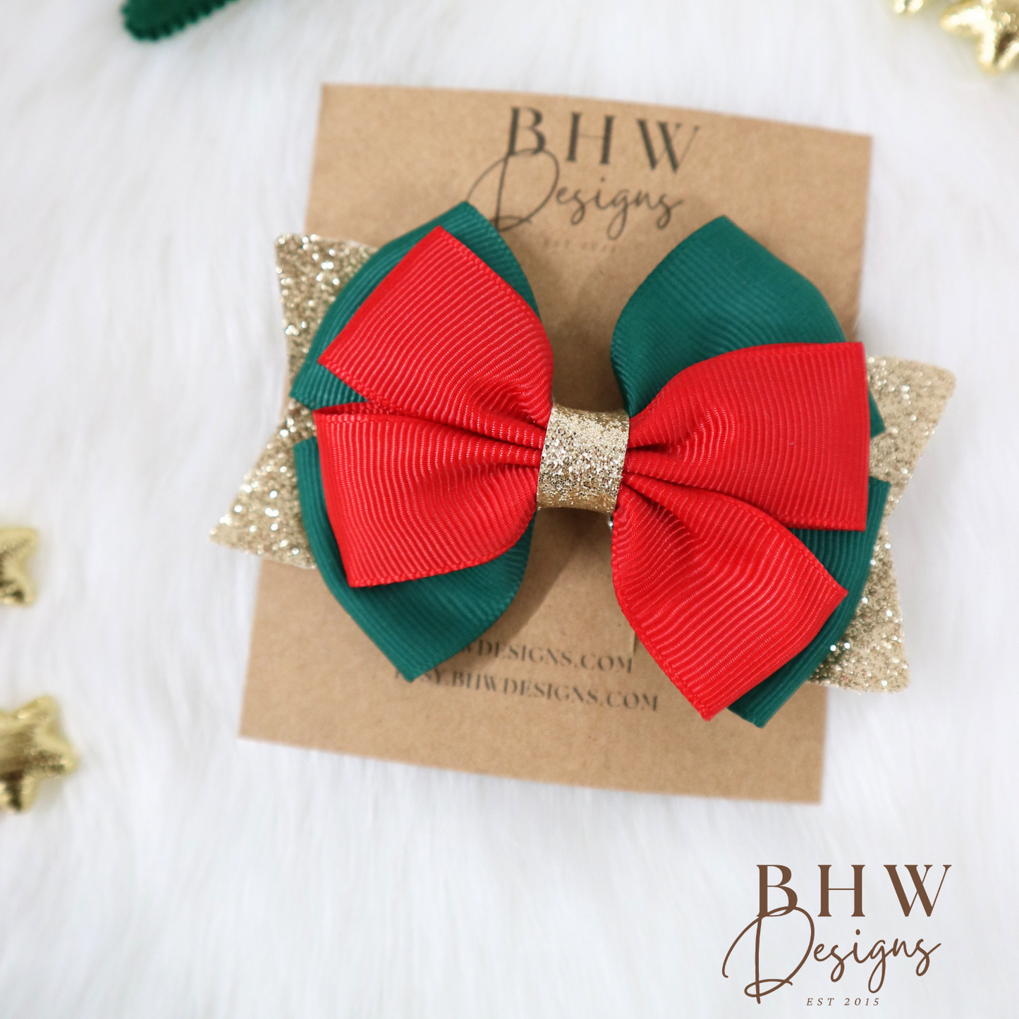 Red and green bow hair clip on a branded card