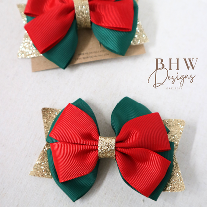 Red and green hair bows with gold accents
